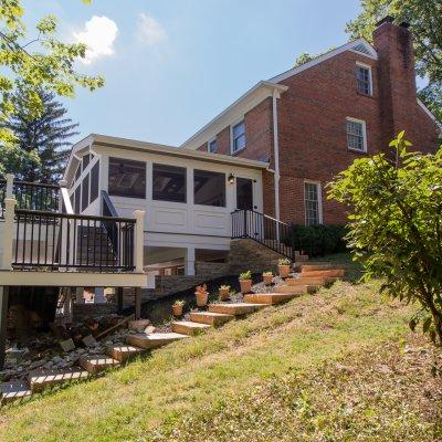 new retaining wall, stairs, deck and screened porch addition