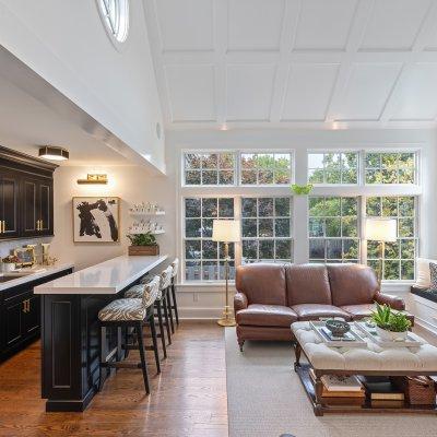 addition large windows vaulted tray ceiling wet bar